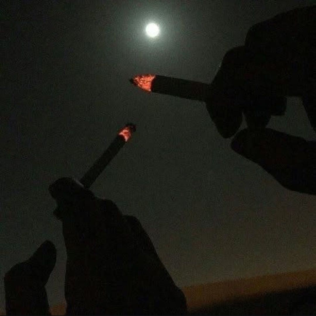 smoking cigarettes under the full moon