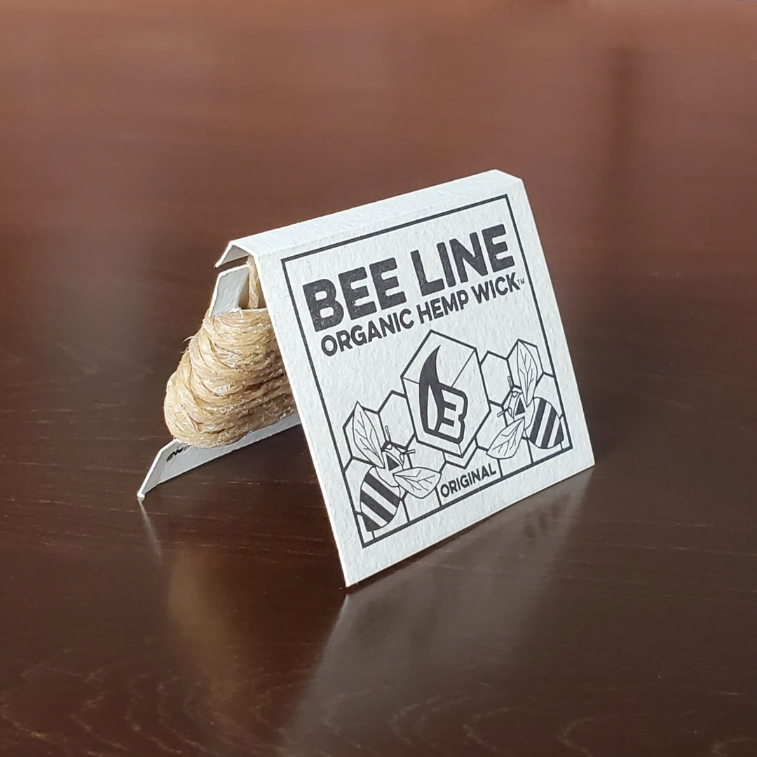 Bee Line Organic Hemp Wick packaging on a wooden surface