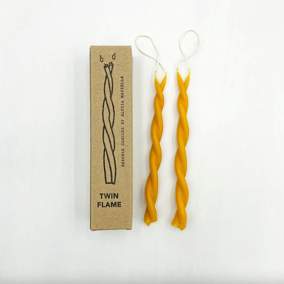 Twisted beeswax candles with a cardboard box labeled 'Twin Flame' on a white background