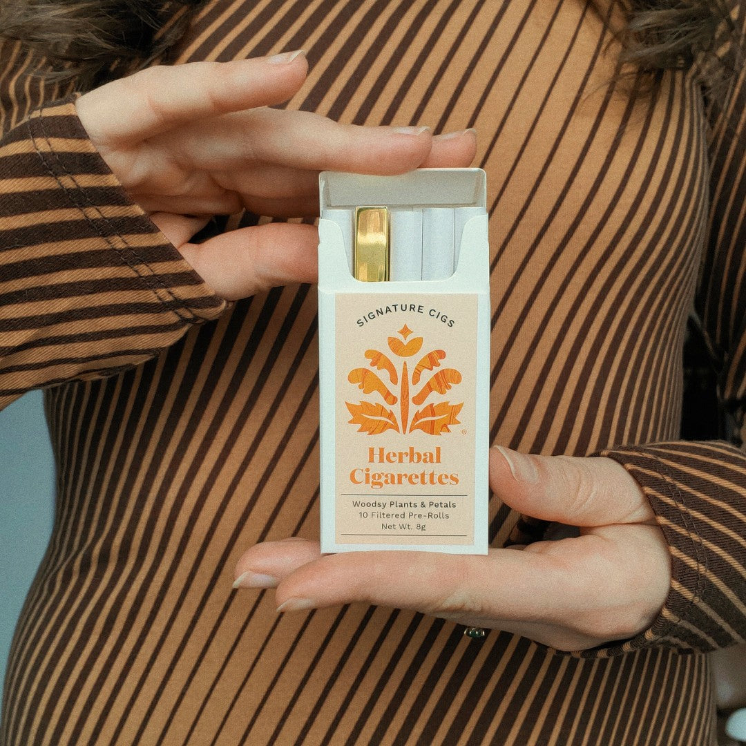 Tsubota Pearl Gold Queue Lighter in a Puff Herbals Cigarette Pack