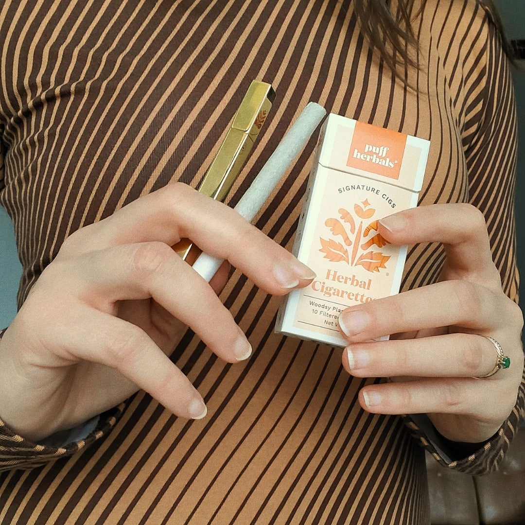 Tsubota Pearl Gold Queue Lighter with a Puff Herbals Cigarette Pack