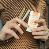 Tsubota Pearl Gold Queue Lighter with a Puff Herbals Cigarette Pack