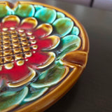 Close-up of a colorful ceramic plate with floral design