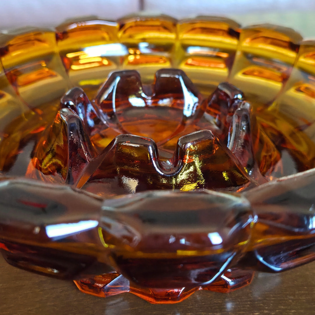 Close-up of a glass ashtray with a textured surface