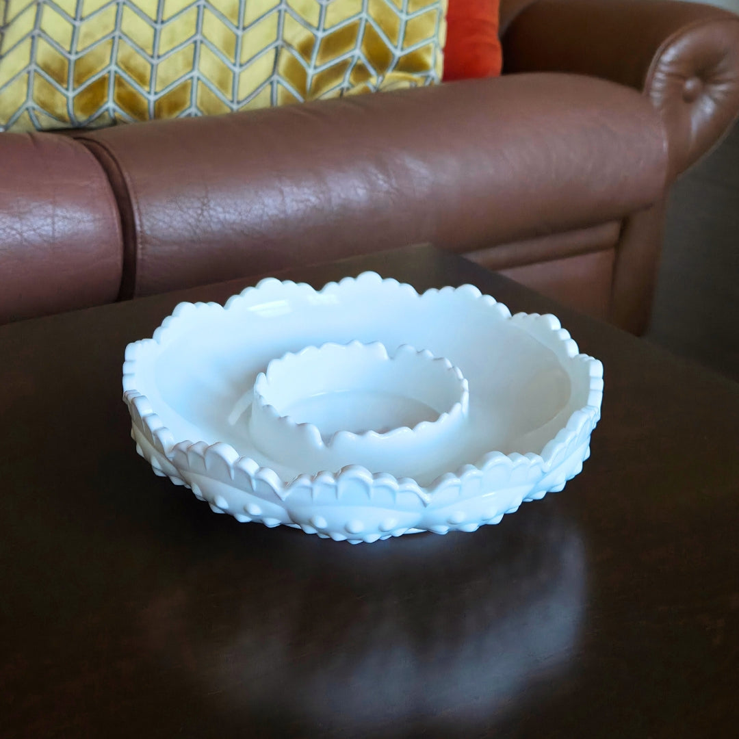 White ceramic bowl with textured surface on a wooden table