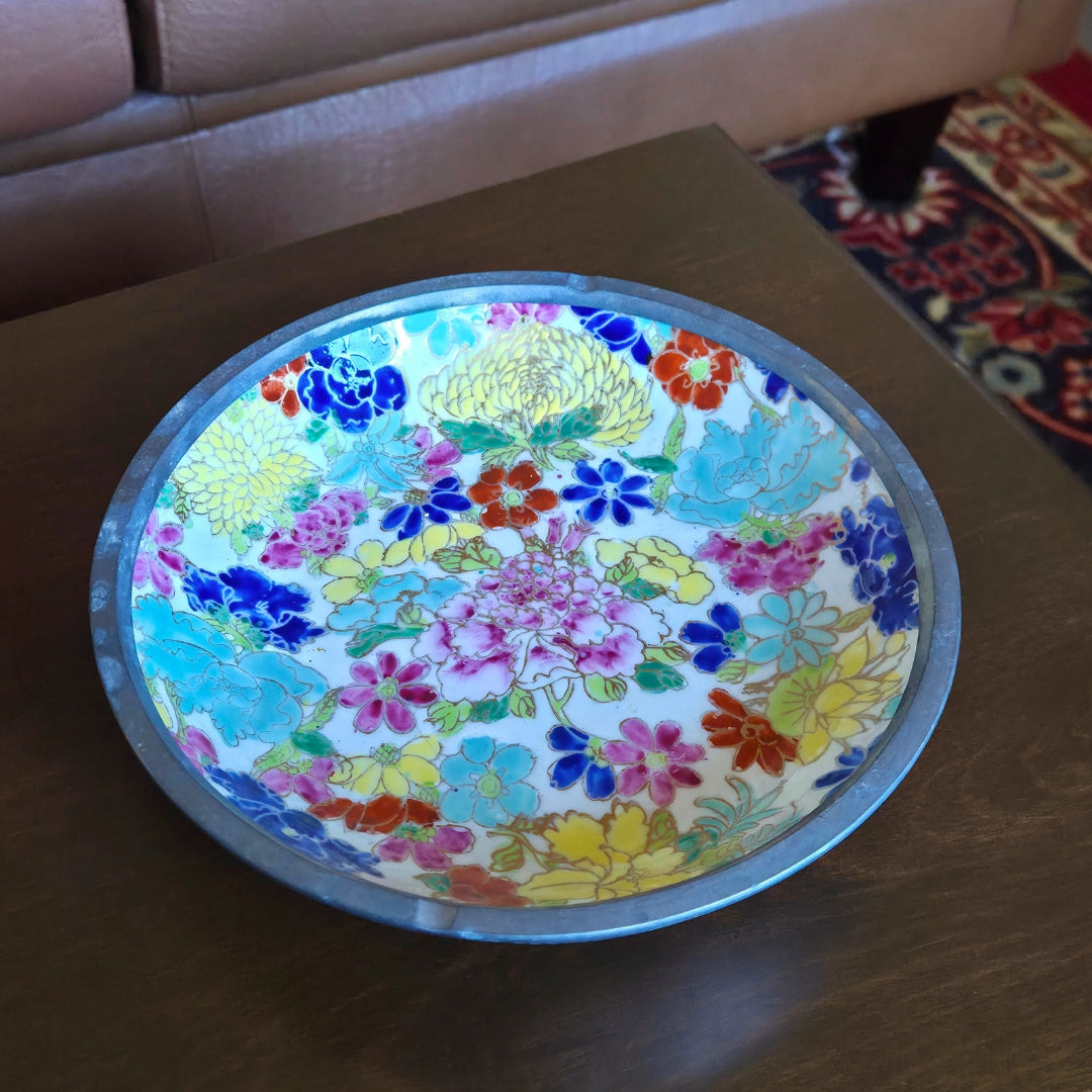 Colorful floral-patterned bowl on a wooden surface
